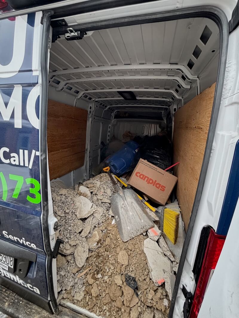 Direct Junk loading renovation debris into the truck