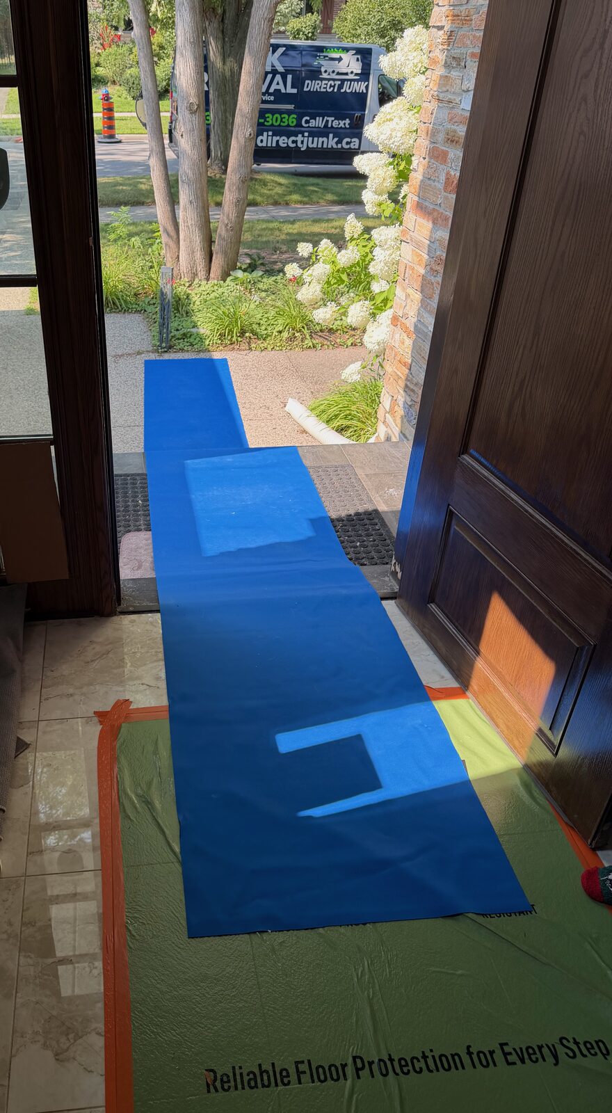Floor protection during a Direct Junk cleanout in Burlington