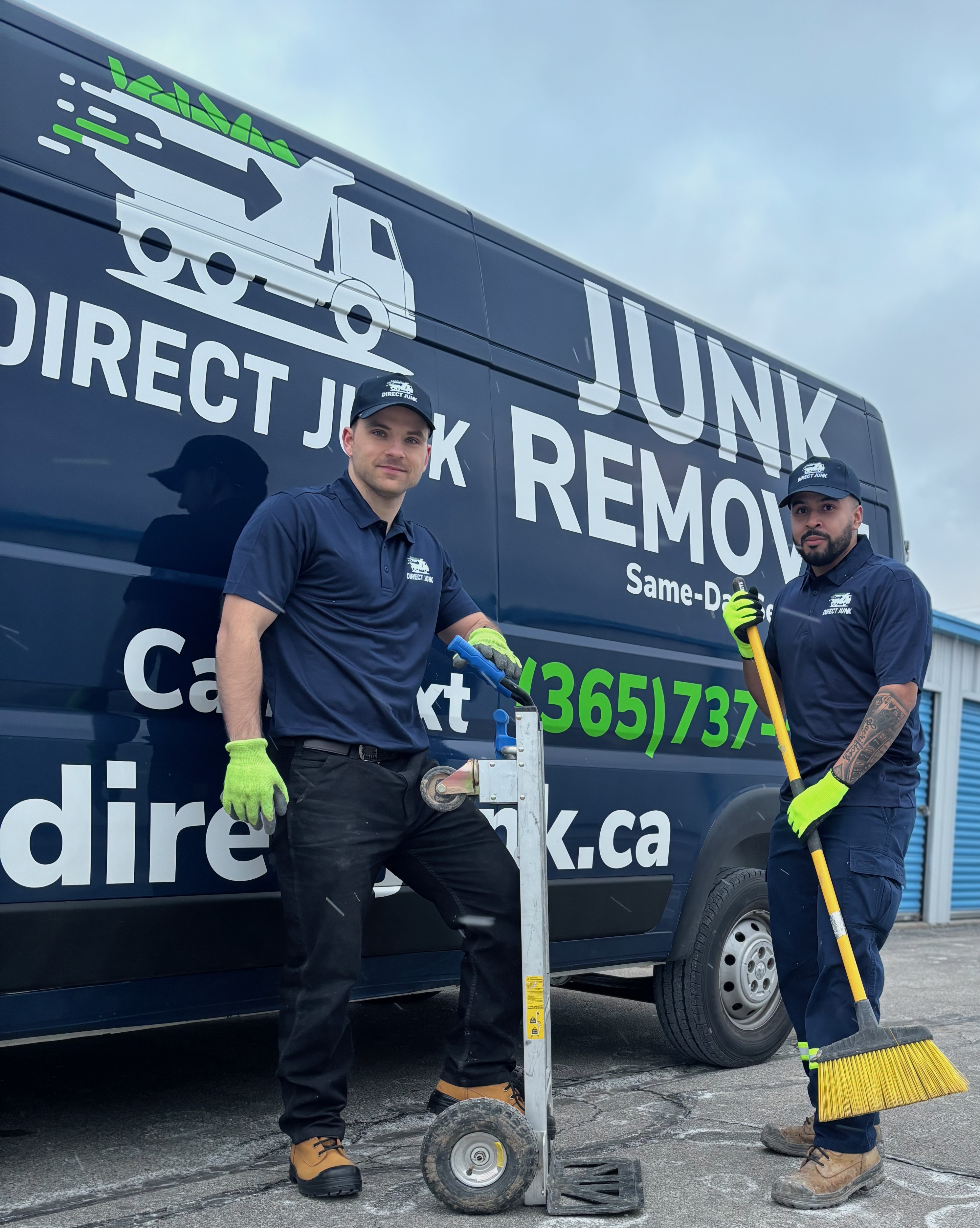 Junk removal crew protecting condo hallway walls