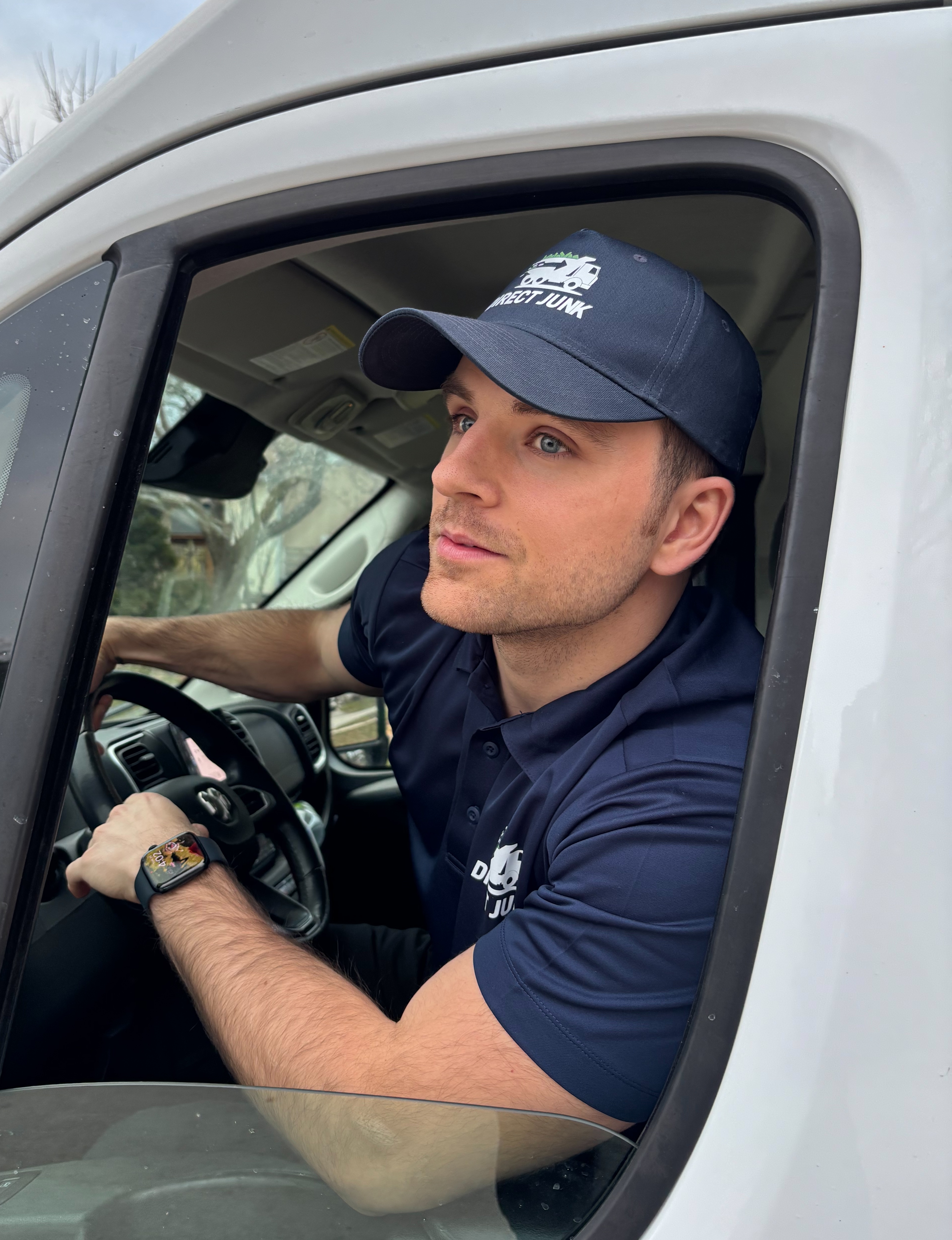 Direct Junk owner arriving on site in Burlington junk removal van