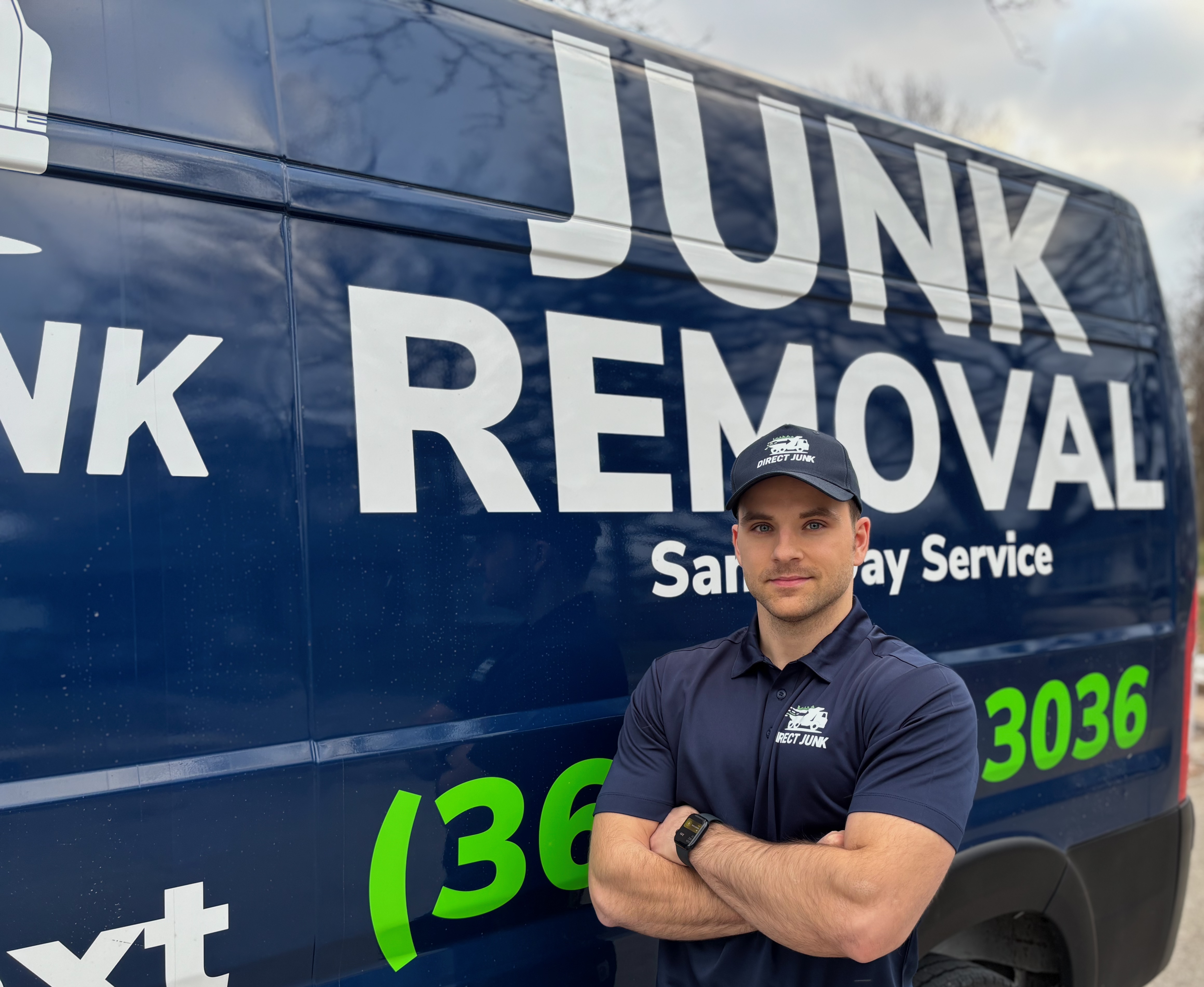 Direct Junk owner standing in front of junk removal van