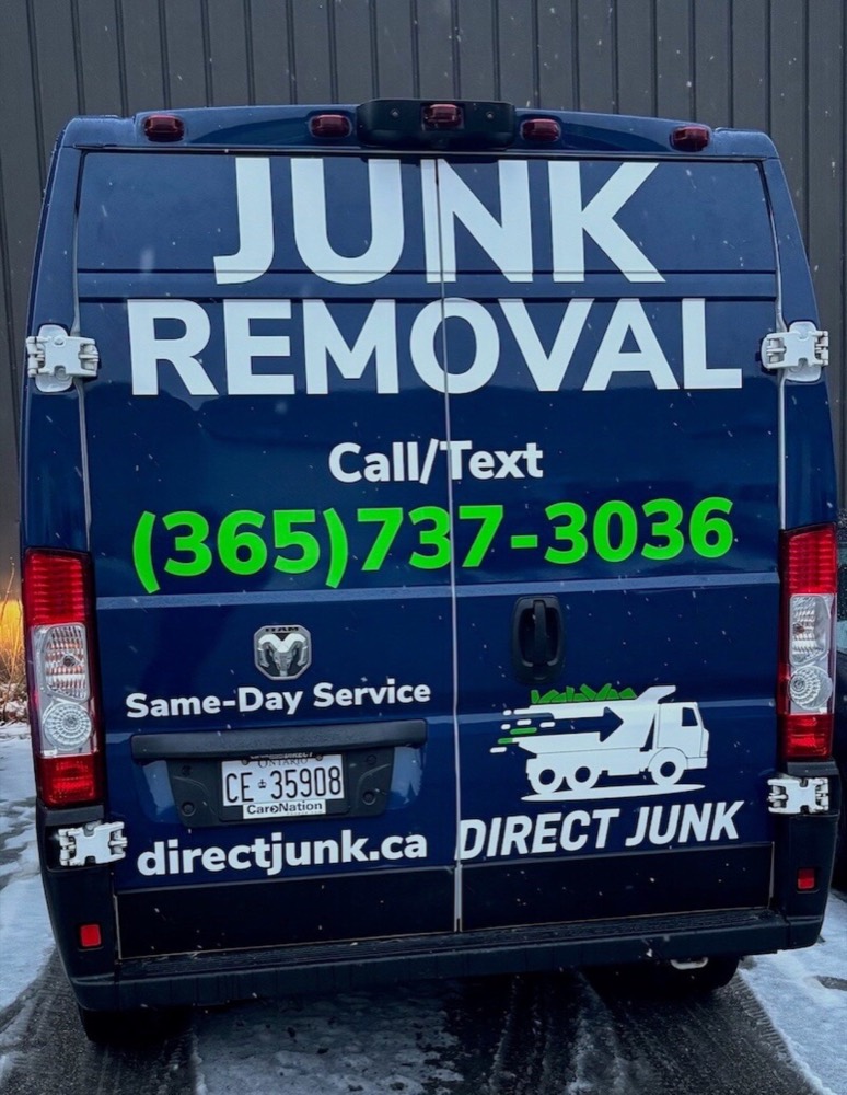 Direct Junk branded junk removal truck with phone number and website