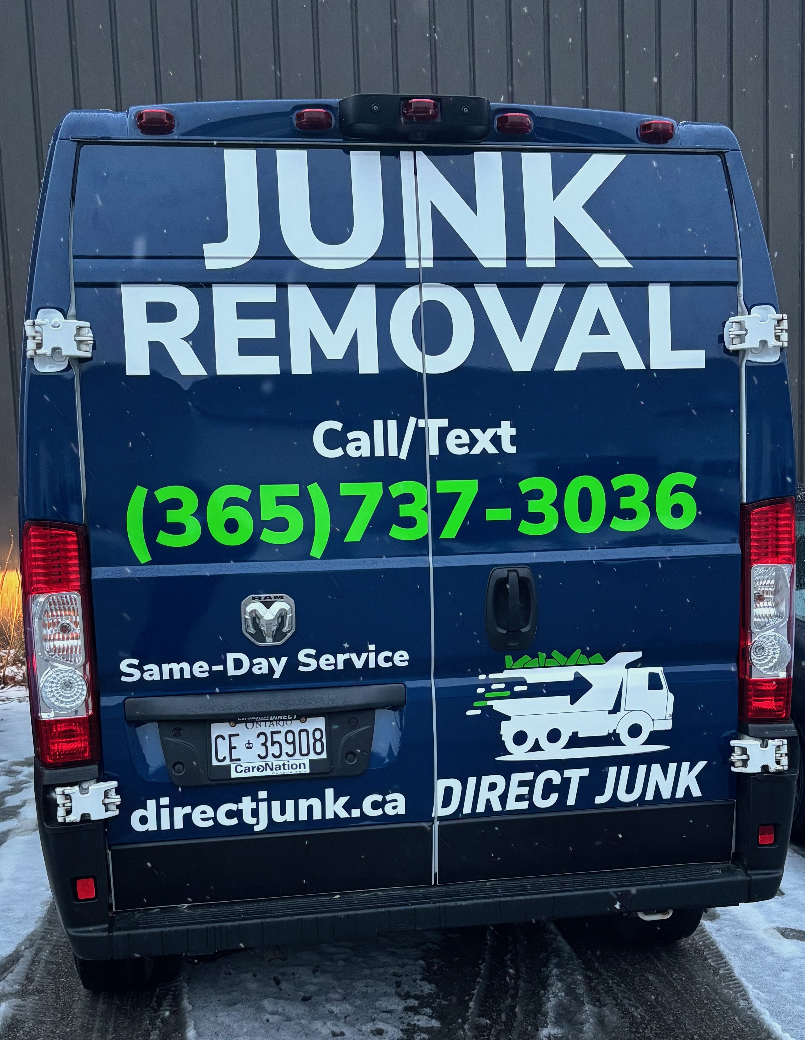 Direct Junk branded junk removal van with phone number and website